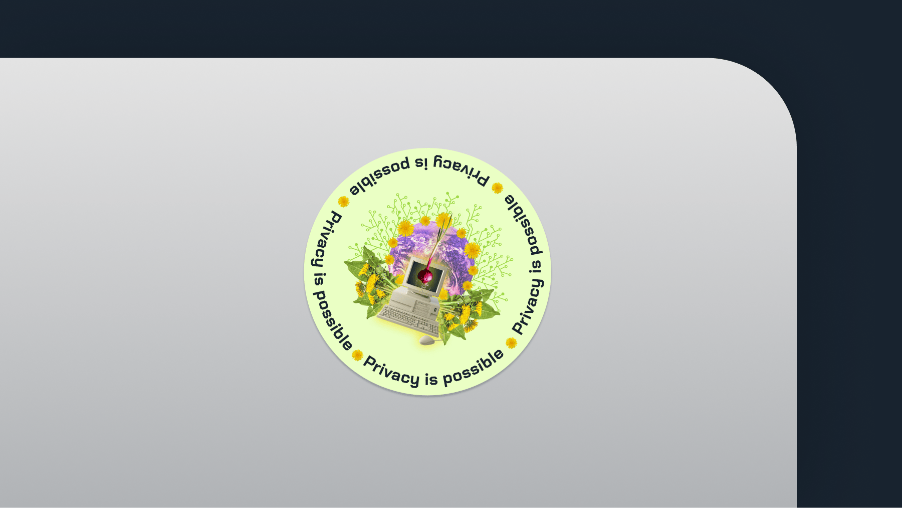 A sticker on the back of a laptop reading "Privacy is possible"